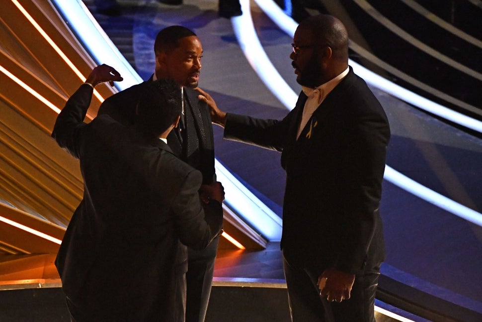 Denzel Washington (L), US actor Will Smith (C) and US actor-producer Tyler Perry chat during the 94th Oscars at the Dolby Theatre in Hollywood, California on March 27, 2022.