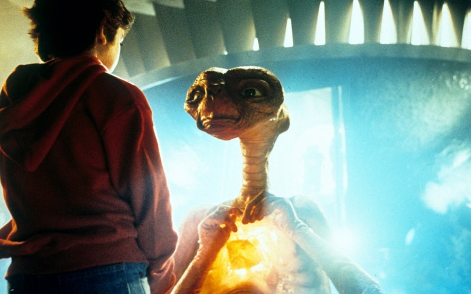 Henry Thomas talking with ET in a scene from the film 'E.T. The Extra-Terrestrial' 1982