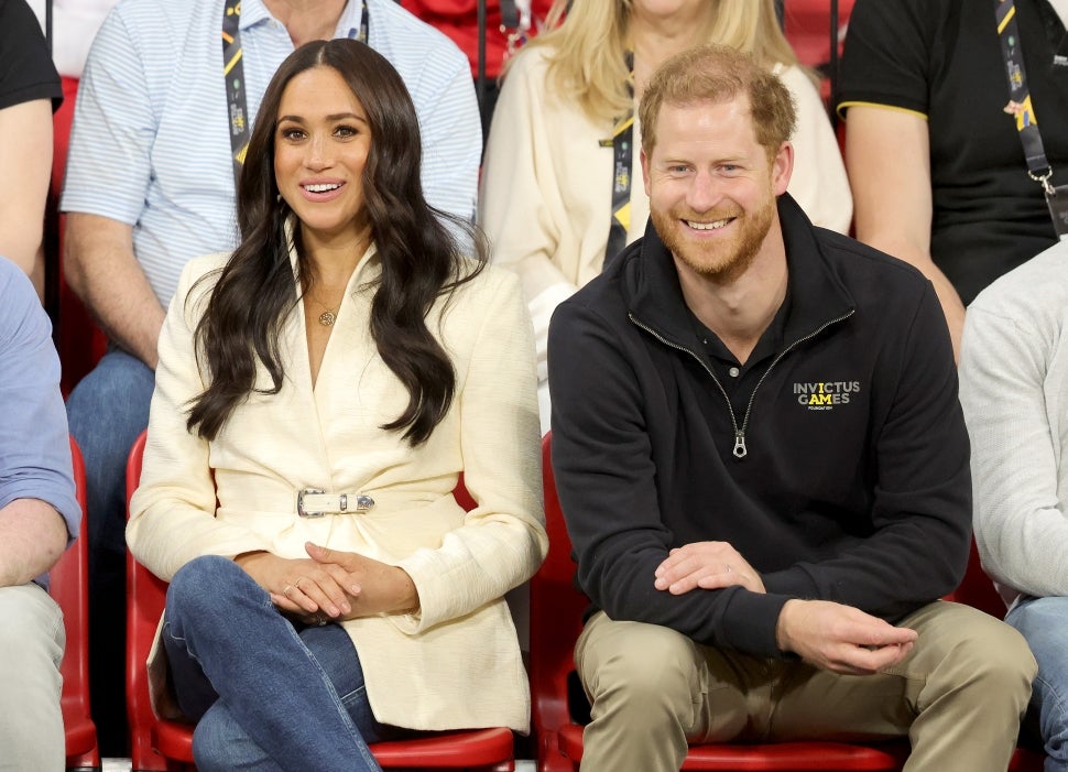 Prince Harry and Meghan Markle Watching Sitting Volleyball