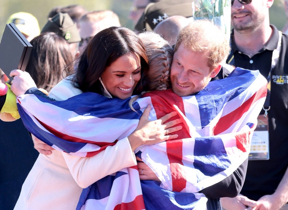 Prince Harry and Meghan Markle Hug Member of Team UK