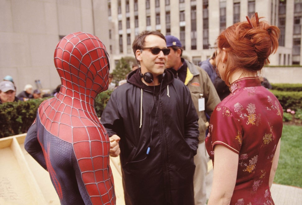 Sam Raimi directs Maguire and Dunst on the set of Spider-Man.