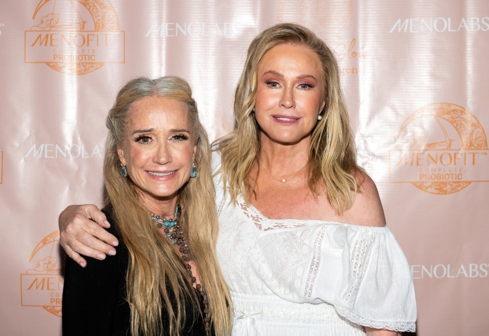 Kim Richards and Kathy Hilton pose at a viewing party for The Real Housewives of Beverly Hills.
