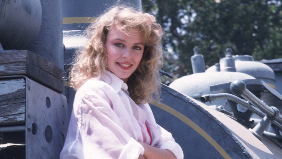 Kylie Minogue poses with another train to promote 'The Loco-Motion' in 1988.