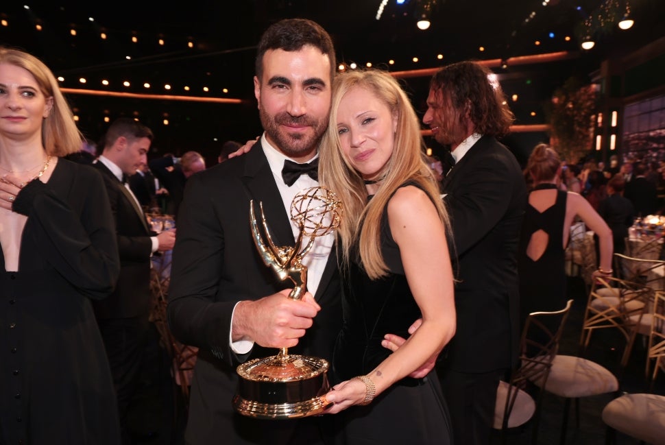 Brett Goldstein, winner of Supporting Actor in a Comedy Series for “Ted Lasso”, and Juno Temple on stage during the 74th Annual Primetime Emmy Awards 