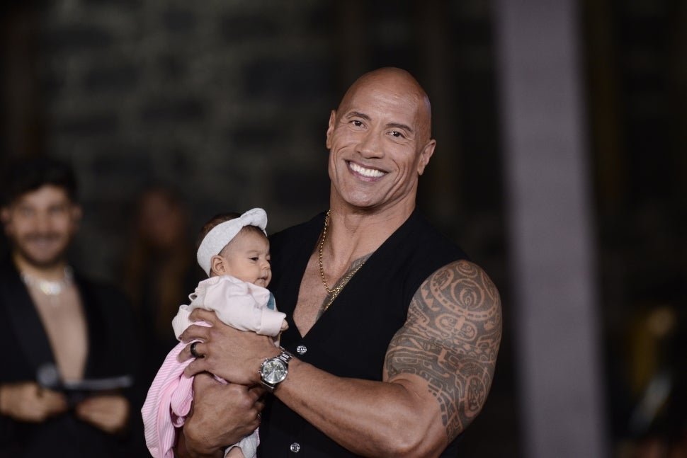 Dwayne Johnson Holds Baby at Black Adam Event in Mexico
