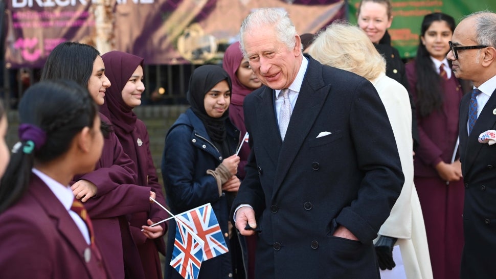 King Charles III and Camilla, Queen Consort meet members of the public during a visit to the Bangladeshi community of Brick Lane on February 8, 2023 in London, England. 