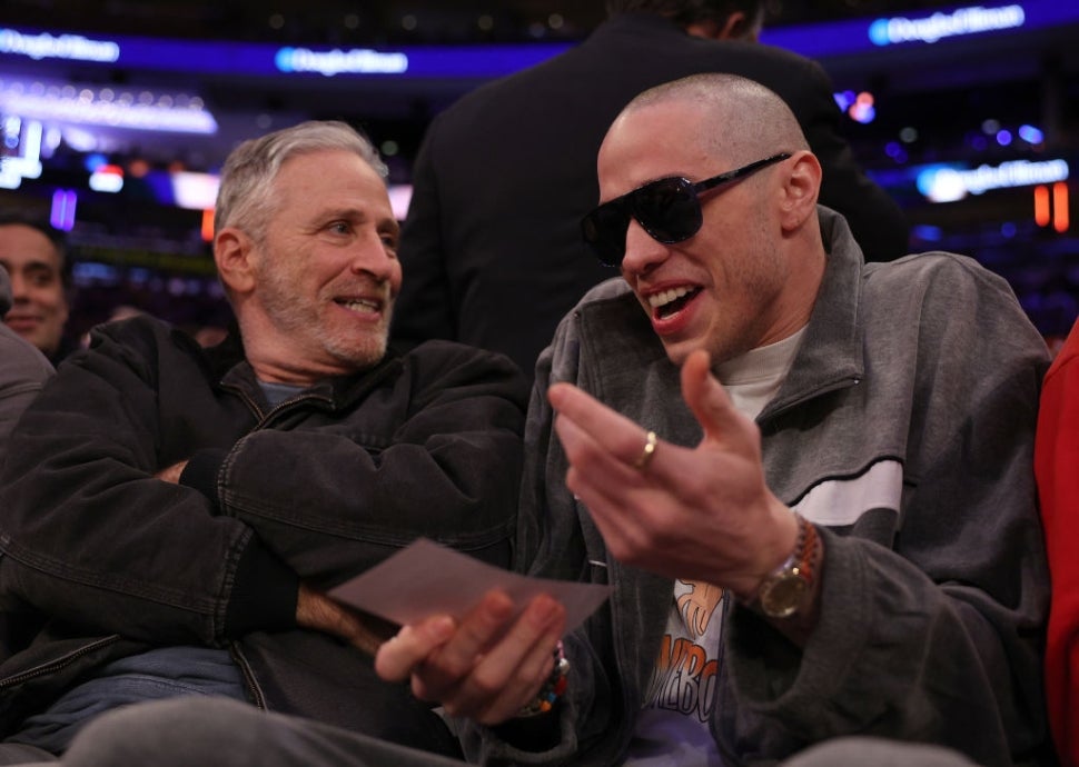 Jon Stewart and Pete Davidson attend the game between the New York Knicks and the Los Angeles Lakers