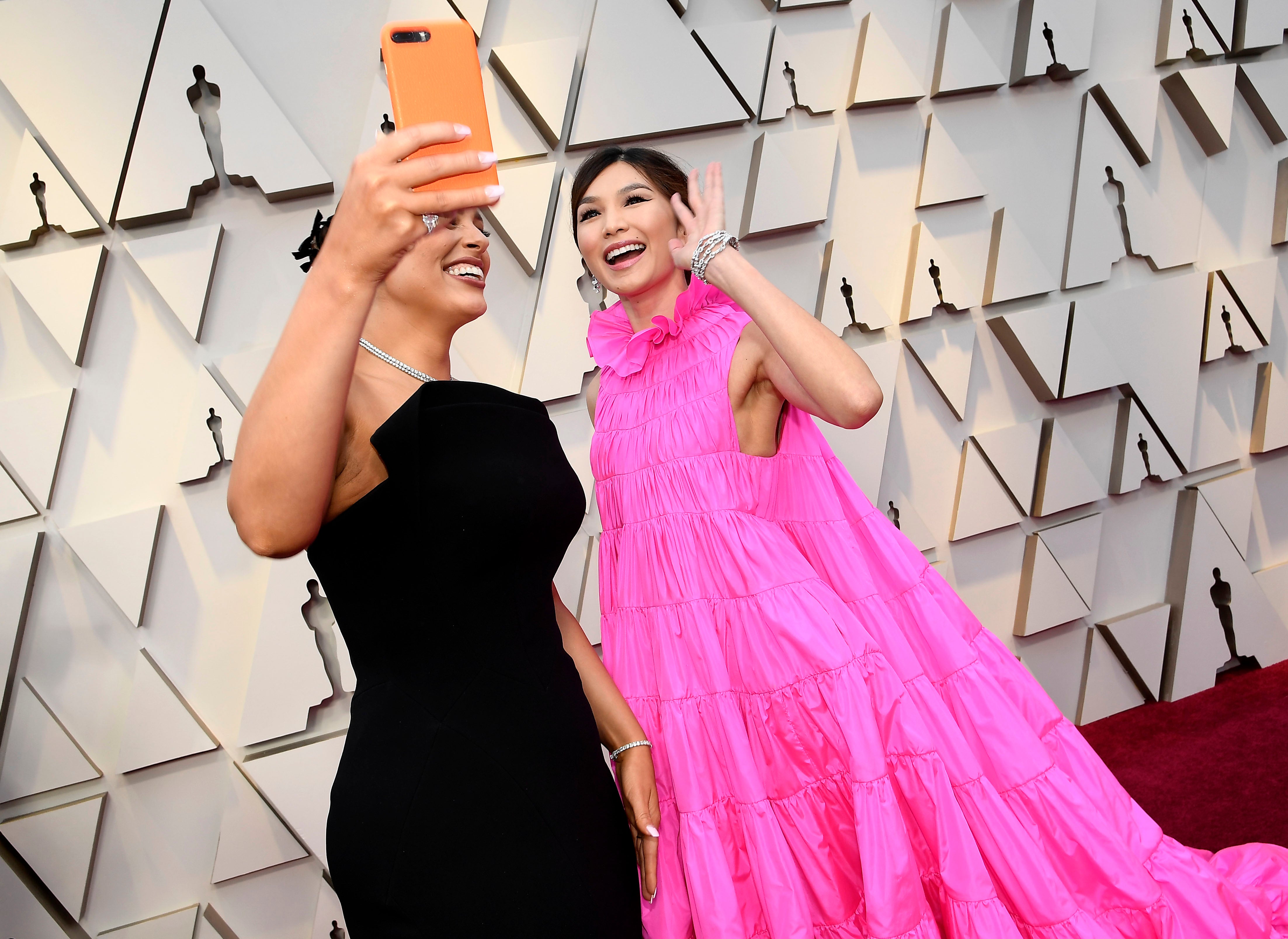 gemma chan pink dress Gemma Chan reveals she stored a giant COOKIE in Oscars dress