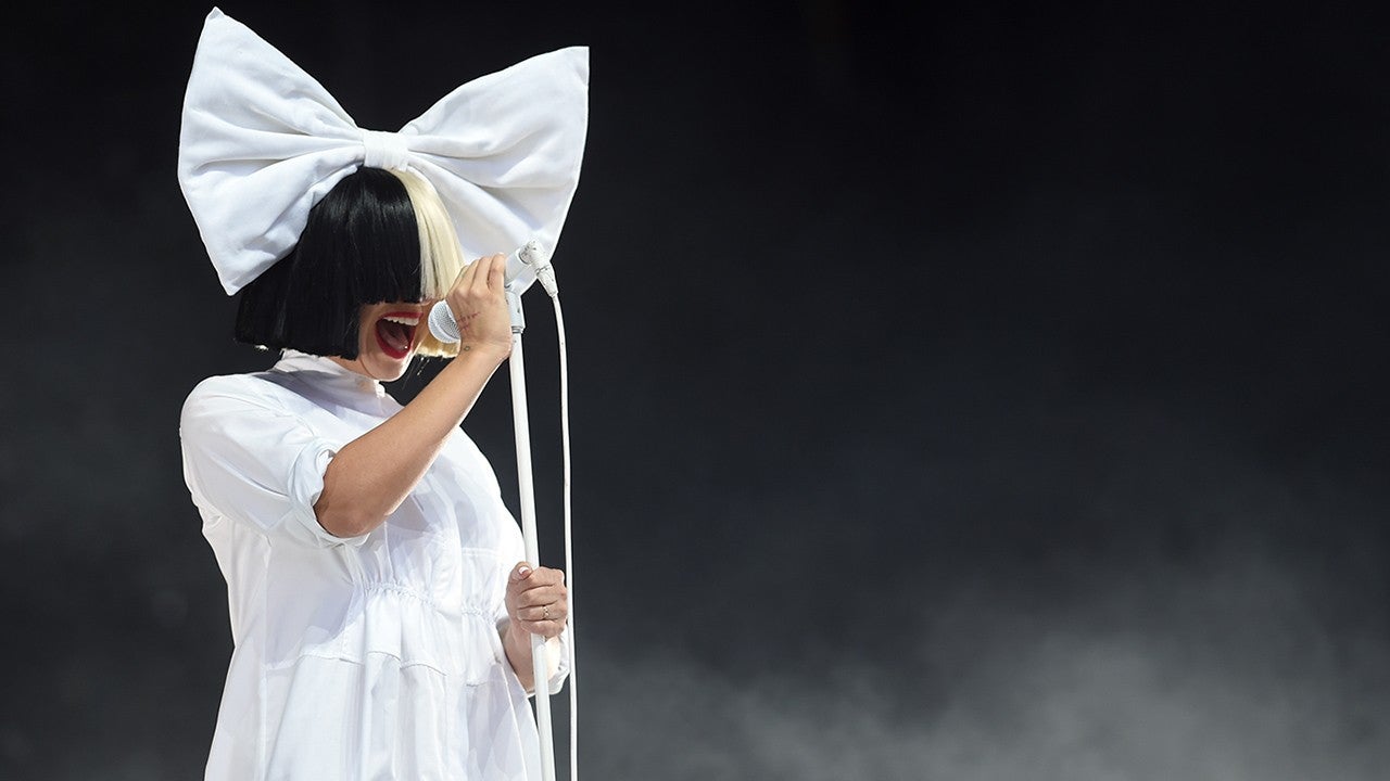 Sia Reveals Her Face After Wind Blows Her Wig