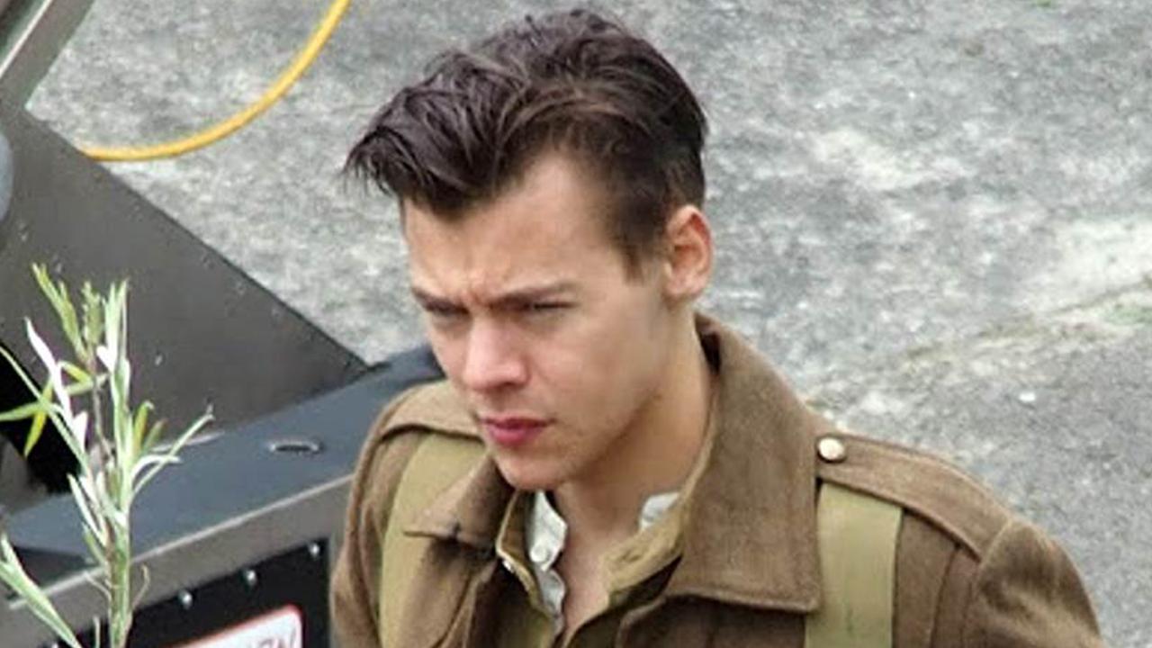 harry styles shows off his new, short haircut on set of