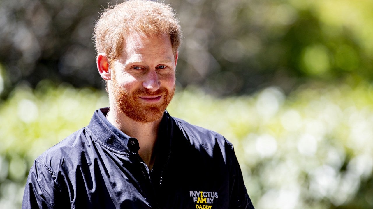 prince harry wears 'daddy' jacket and joyfully receives
