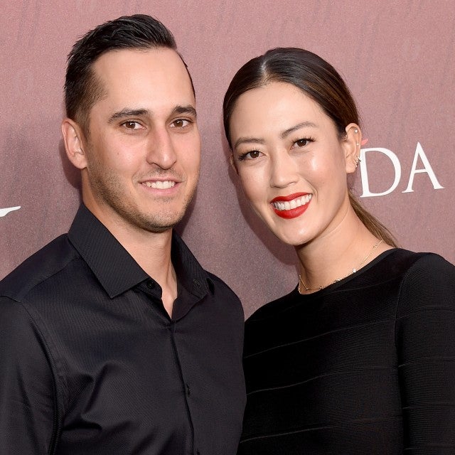 Michelle Wie and Jonnie West arrive at the Sports Illustrated Fashionable 50 at The Sunset Room on July 18, 2019 in Los Angeles, California. 