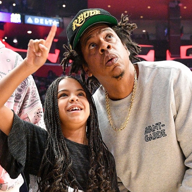 Jay-Z and Blue Ivy Carter attend a basketball game between the Los Angeles Clippers and the Los Angeles Lakers 