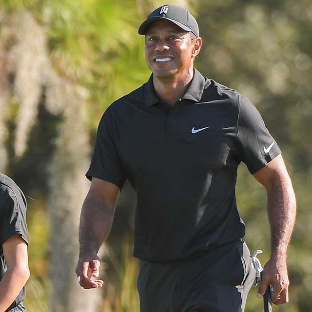 Tiger Woods and his son Charlie Woods practice together during the PGA TOUR Champions Friday Pro-am at PNC Championship at Ritz-Carlton Golf Club on December 17, 2021 in Orlando, Florida. 