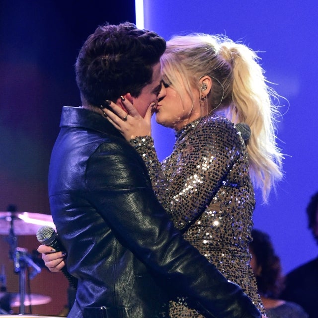 Charlie Puth (L) and Meghan Trainor kiss onstage during the 2015 American Music Awards at Microsoft Theater on November 22, 2015 in Los Angeles, California