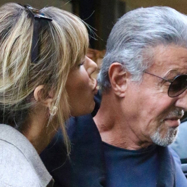 Jennifer Flavin almost plants a kiss on Sylvester Stallone in Midtown Manhattan.