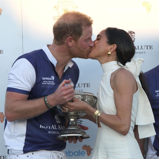 The Duchess of Sussex presents the trophy to her husband, the Duke of Sussex after his team the Royal Salute Sentebale Team defeated the Grand Champions Team, in the Royal Salute Polo Challenge, to benefit Sentebale, at The USPA National Polo Center in Wellington, Florida, US