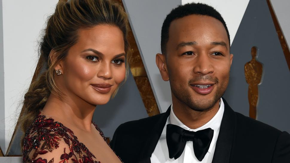 Chrissy Teigen S Baby Daughter Luna Is The Spitting Image Of Her Mom Lovingly Cuddles With Dad John Legend Entertainment Tonight