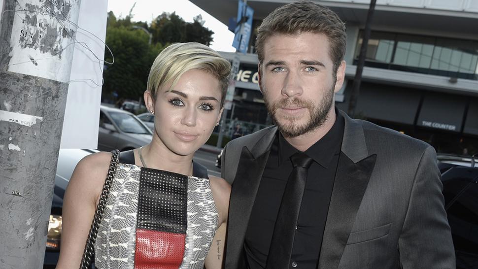 Miley Cyrus and Liam Hemsworth pack on PDA