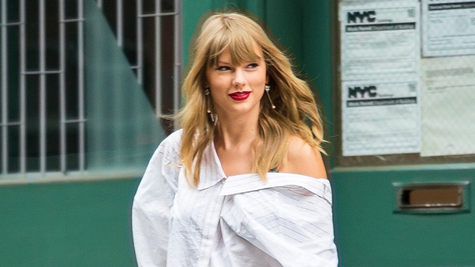Taylor Swift white shirt and ankle boots