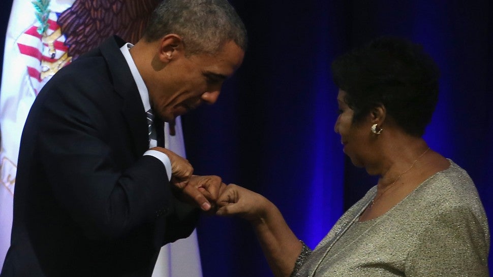 Aretha Franklin sings at a farewell ceremony for Attorney General Eric Holder at the Justice Department.