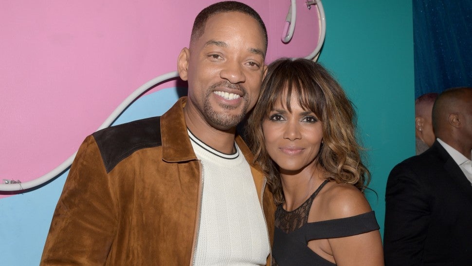 Will Smith and Halle Berry pose backstage at the 2016 MTV Movie Awards at Warner Bros. Studios on April 9, 2016 in Burbank, California. 