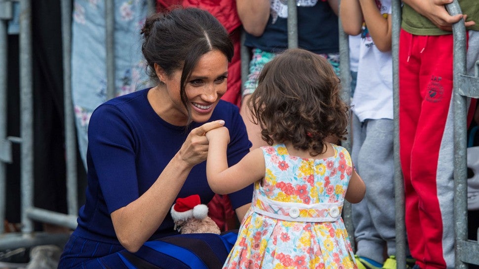 Meghan Markle with young girl in New Zealand