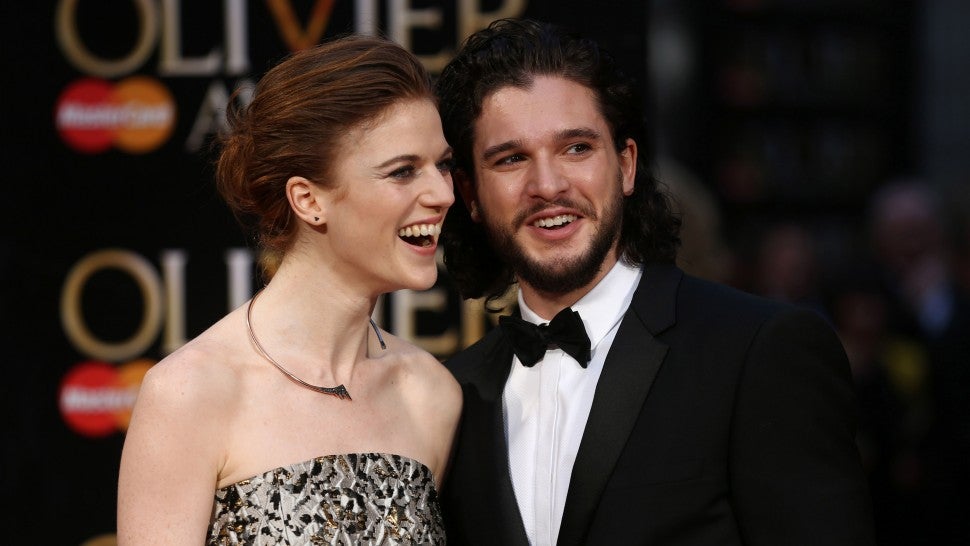Kit Harington and Rose Leslie pose on the red carpet upon arrival to attend the 2016 Laurence Olivier Awards in London on April 3, 2016.