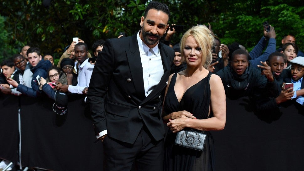  Adil Rami and  Pamela Anderson arrive to take part in a TV show on May 19, 2019 in Paris, as part of the 28th edition of the UNFP (French National Professional Football players Union) trophy ceremony.