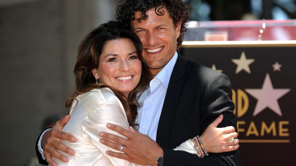 Shania Twain poses with her husband, Frederic Nicolas Thiebaud, after being honored by a Star on the Hollywood Walk of Fame in Hollywood, California on June 2, 2011. 