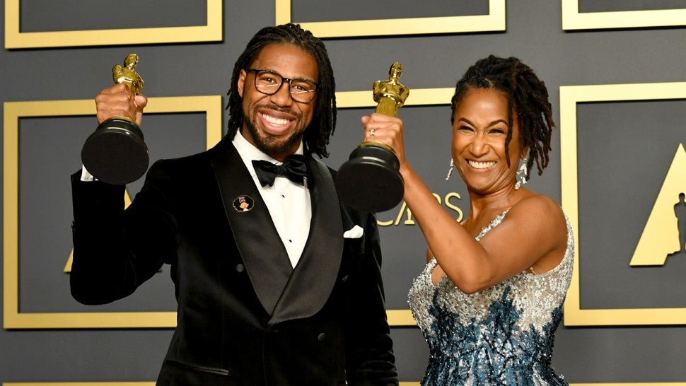 Director Matthew A. Cherry and producer Karen Rupert Toliver, winners of the Animated Short Film award for “Hair Love,” pose in the press room during the 92nd Annual Academy Award
