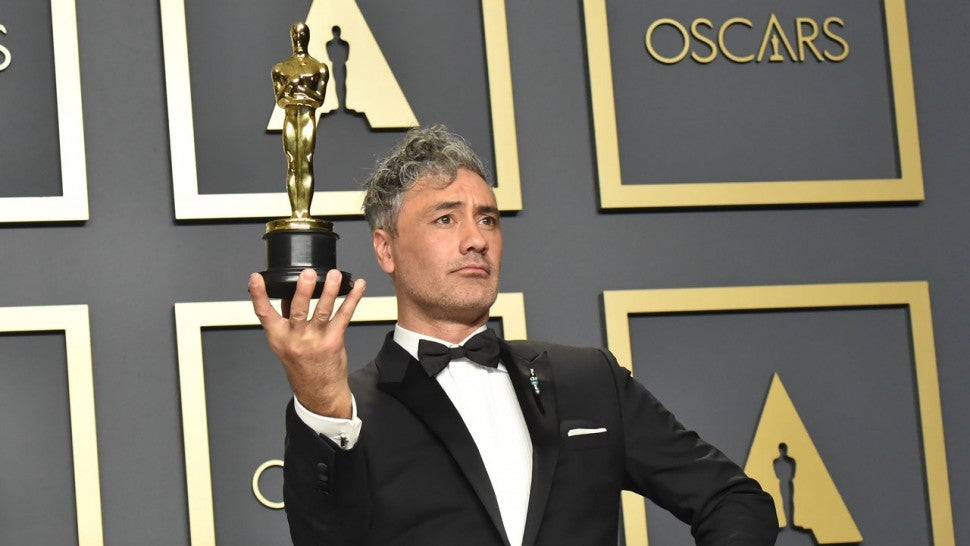 taika Waititi, winner of the Adapted Screenplay award for "Jojo Rabbit," poses in the press room during the 92nd Annual Academy Awards