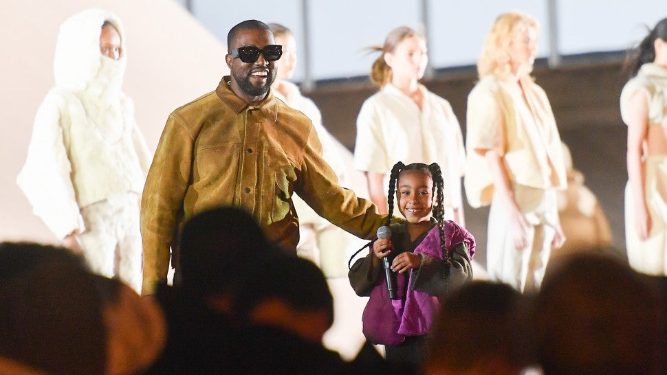 Kanye West and North West at yeezy s8 show