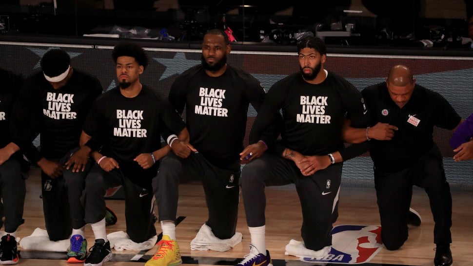 LeBron James and Fellow NBA Players Kneel for National Anthem in Black