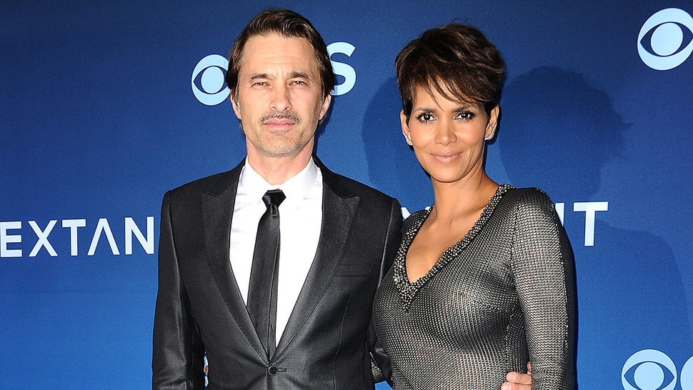 Olivier Martinez and actress Halle Berry attend the premiere of "Extant" at California Science Center on June 16, 2014 in Los Angeles, California.