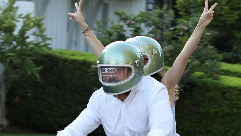 *EXCLUSIVE* -Ben Affleck goes out for a cruise with girlfriend Ana De Armas on his new BMW motorcycle that he presumably got as a birthday gift from her along with matching helmets! The pair were so excited to test drive the new bike that they wore their helmets with the stickers sill on the front. Ben turned 48 yesterday and the actor certainly seemed to have a happy one! *Shot on August 15, 2020*