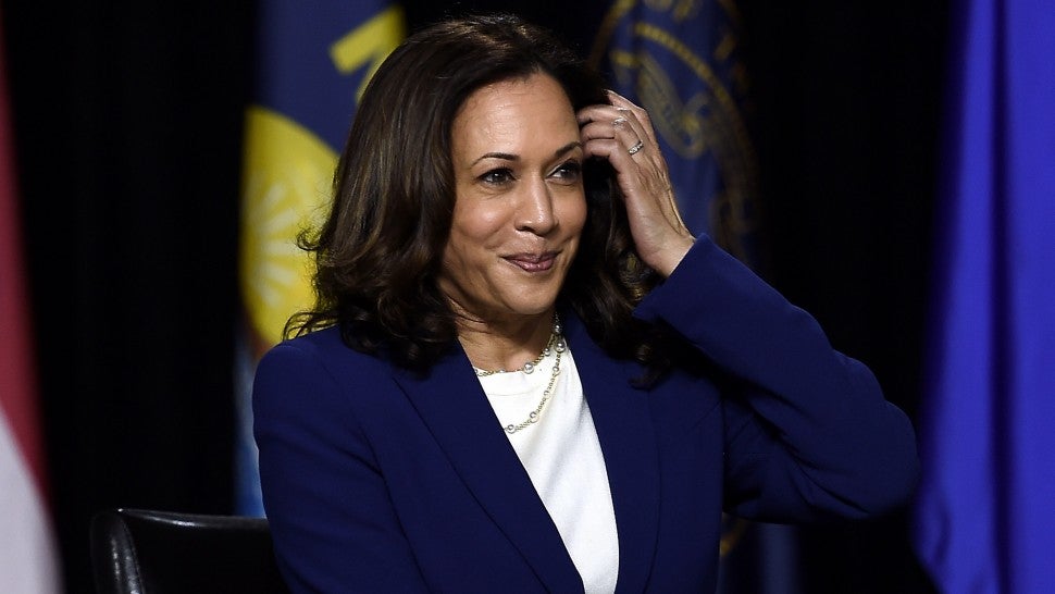 Democratic vice presidential running mate, US Senator Kamala Harris, listens to presidential nominee and former US Vice President Joe Biden speak during their first press conference together in Wilmington, Delaware, on August 12, 2020.