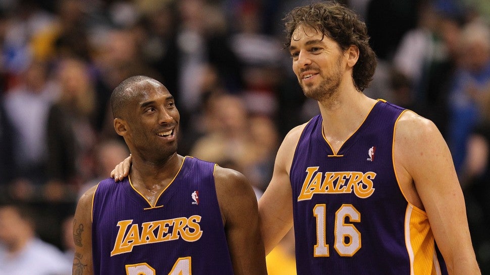 Kobe Bryant #24 and Pau Gasol #16 of the Los Angeles Lakers react after a 96-91 win against the Dallas Mavericks at American Airlines Center on March 12, 2011 in Dallas, Texas. NOTE TO USER: User expressly acknowledges and agrees that, by downloading and or using this photograph, User is consenting to the terms and conditions of the Getty Images License Agreement.