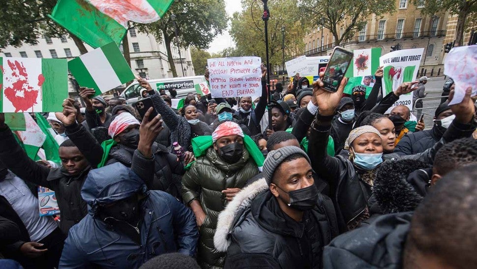 Protestors chant outside Downing street as up to one thousand British Nigerians protest against corruptions and killings in Lagos on October 21, 2020 in London, England.
