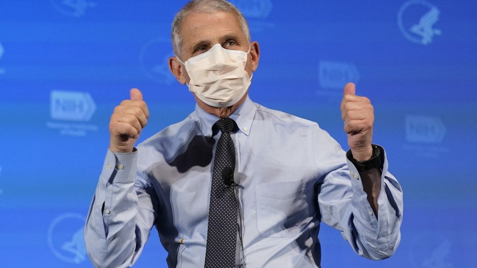 Anthony Fauci, director of the National Institute of Allergy and Infectious Diseases, gestures after receiving the Moderna Inc. Covid-19 vaccine during an event at the NIH Clinical Center Masur Auditorium in Bethesda, Maryland, U.S., on Tuesday, Dec, 22, 2020. 