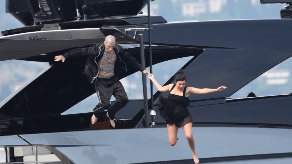 See Kourtney Kardashian and Travis Barker's Dramatic Leap From a Yacht After Their Italian Wedding.jpg