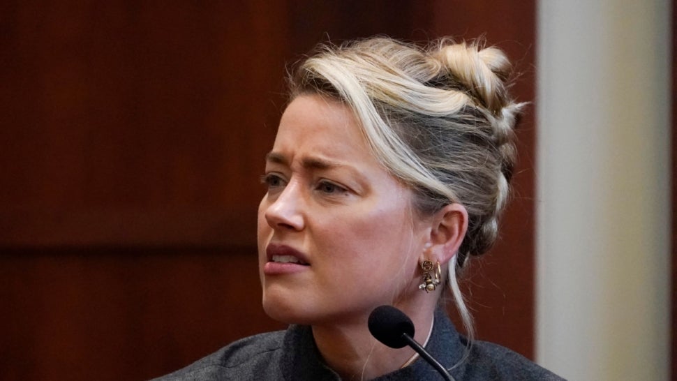 Amber Heard Denies Accusation That She Pooped the Bed, Says It Was the Dog.jpg