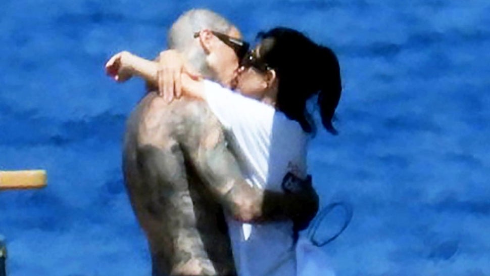 Kourtney Kardashian and Travis Barker Share a Kiss in Italy Ahead of Wedding Day.jpg
