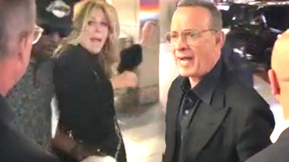 Tom Hanks Yells at Fans to 'Back the F**k Off' After They Cause Wife Rita Wilson to Trip.jpg