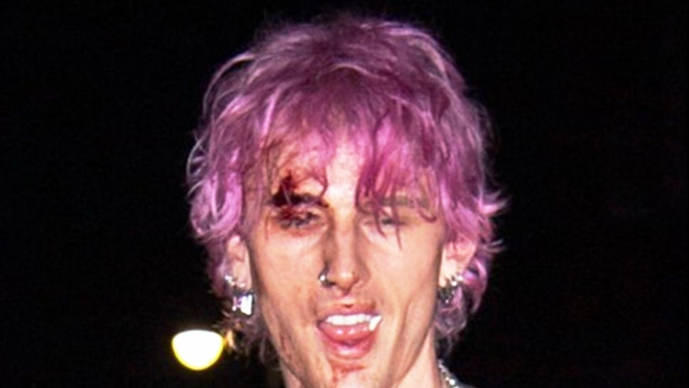 Machine Gun Kelly Has Blood Dripping Down His Face After Smashing a Champagne Flute on His Head.jpg