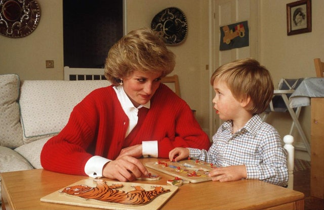 Princess Diana and Prince William play with jigsaw puzzles