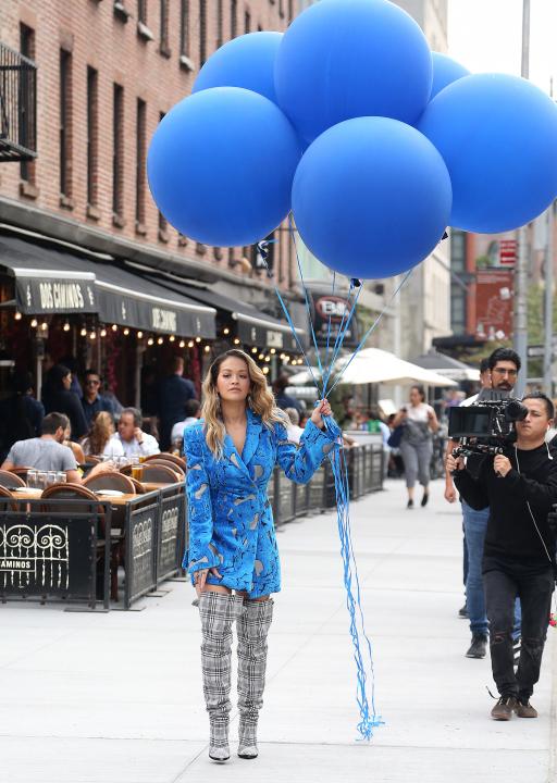 Rita Ora holding balloons