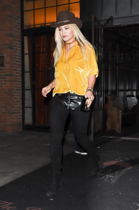 Rita Ora in yellow velvet and cowboy hat in NYC