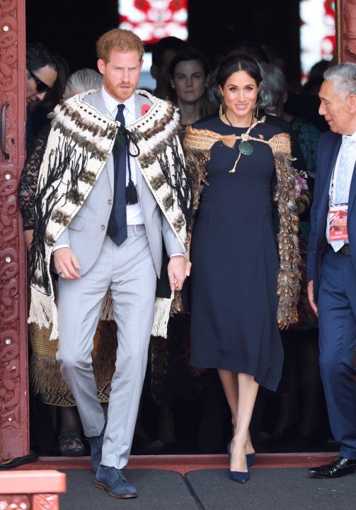 Prince Harry and Meghan Markle don Maori cloaks while visiting New Zealand on Oct. 30
