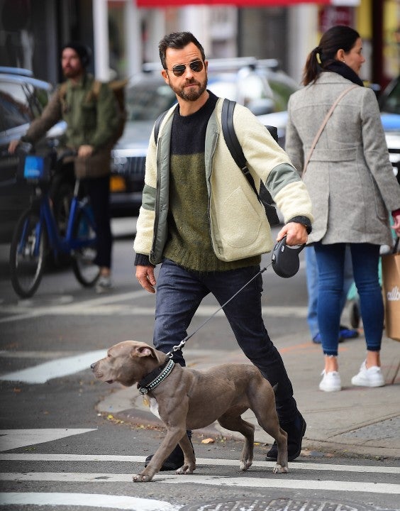 Justin Theroux walks his dog in NYC